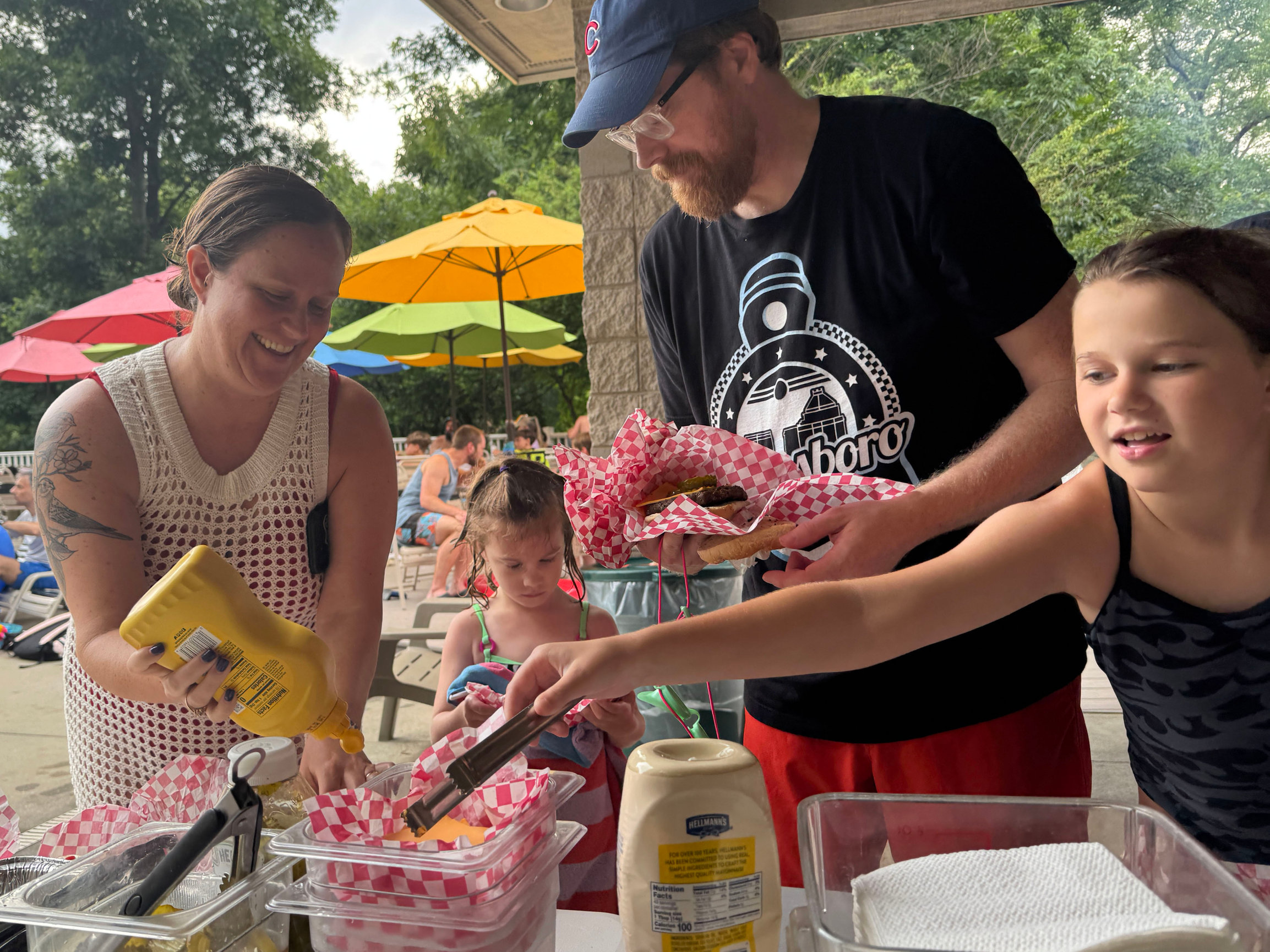 Photo of a Friendly family enjoying a hot dog and burger cookout in the 2025 season.